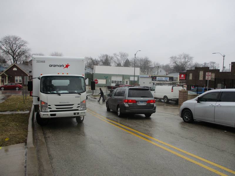 A delivery truck parked on Cora Street takes up a lane near the corner of Ruby Street while making deliveries to the Carnitas Don Jose y Supermercado in Joliet on Feb. 22, 2023.
