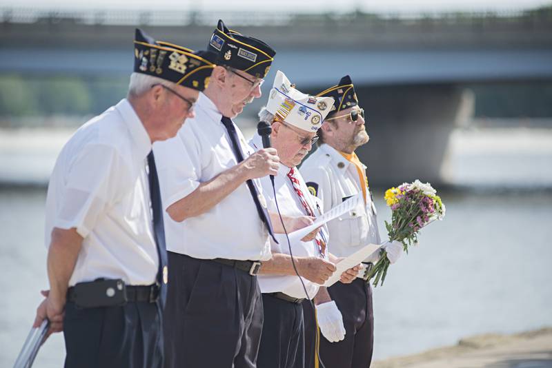 American Legion Post 12 representatives Jim Devine (left), Mike Barney, Dwight Moss and Dave Devine lead a ceremonial wreath laying at the Dixon riverfront Monday, May 30, 2022 to honor the sailors who died at sea.