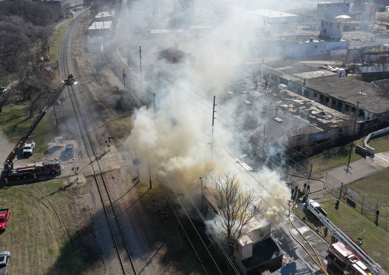 An aerial view of the smoke billowing as firefighters work the scene of a structure fire at the former Platform 31 tavern on Monday, March 24, 2025 on Water Street in Peru. The fire was upgraded to a three-alarm summing fire departments from La Salle, Utica, Mendota, Tonica, Ottawa, Ladd, Lostant, Cedar Point, Troy Grove and Peru responded to the fire.