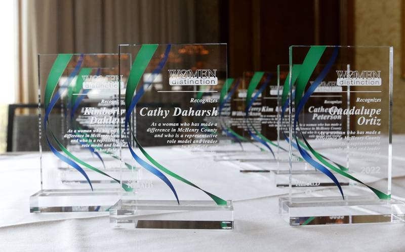 Awards wait to be handed out during the Northwest Herald's Women of Distinction award luncheon Wednesday June 29, 2022, at Boulder Ridge Country Club, 350 Boulder Drive in Lake in the Hills. The luncheon recognized 10 women in the community as Women of Distinction plus Lisa Hoeppel as the first recipient of the Kelly Buchanan Woman of Inspiration award. This year's Women of Distinction are Catherine Peterson, Cathy Daharsh. Laura King, Kim Ulbrich, Kimberly Dahlem, Laura Evers, Brenda Napholz, Guadalupe Ortiz, Terry Willcockson and Cheryl Wormley.