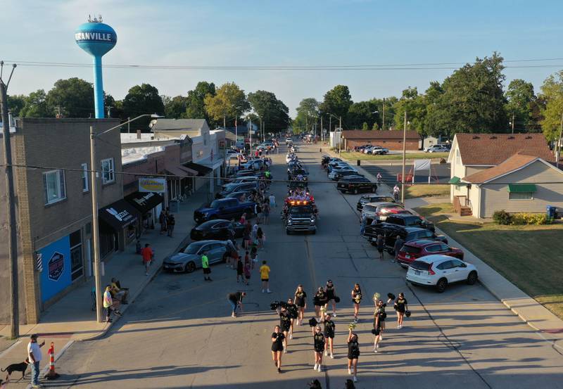 Putnam County High School cheerleaders walk during the inaugural Homecoming parade on Wednesday, Sept. 17, 2025 down McCoy Street in Granville.