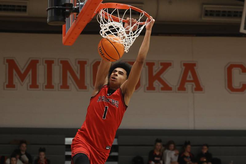 Bolingbrook’s Brady Pettigrew throws down a dunk against Minooka on Tuesday, Dec. 17, 2024 in Minooka.