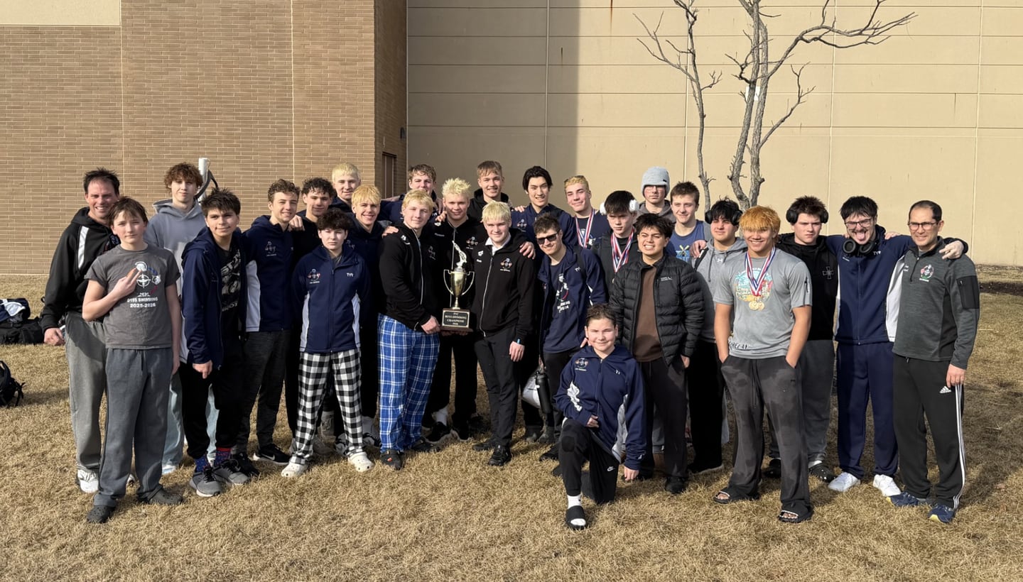 Cary-Grove co-op's boys swimming team poses with the Fox Valley Conference championship trophy on Saturday, Feb. 14, 2026, at Woodstock North High School.