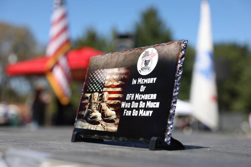 A memorial plaque sits on the main stage at the 11th Annual Operation Firm Handshake Veteran’s Picnic on Saturday, Sept. 7, 2024 in Coal City.