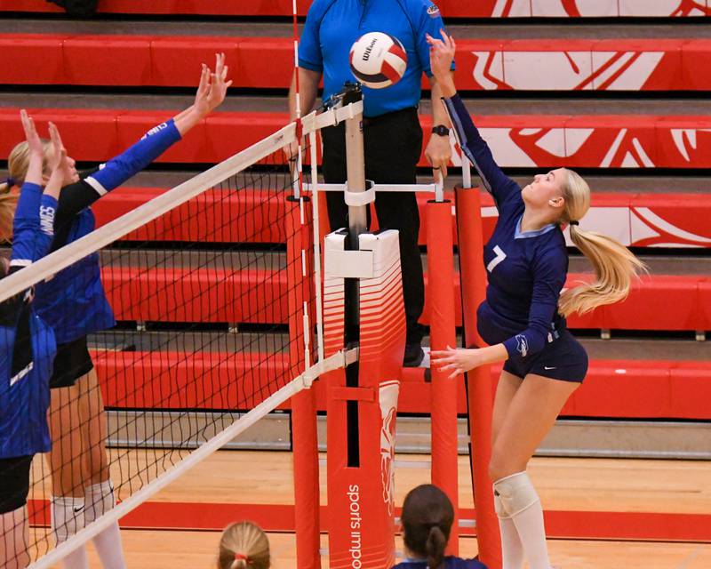 Nazareth Academy's Lexi Van Eekeren (7) spikes the ball past Geneva defenders during the sectional title game on Thursday Nov. 6, 2025, held at Timothy Christian High School.