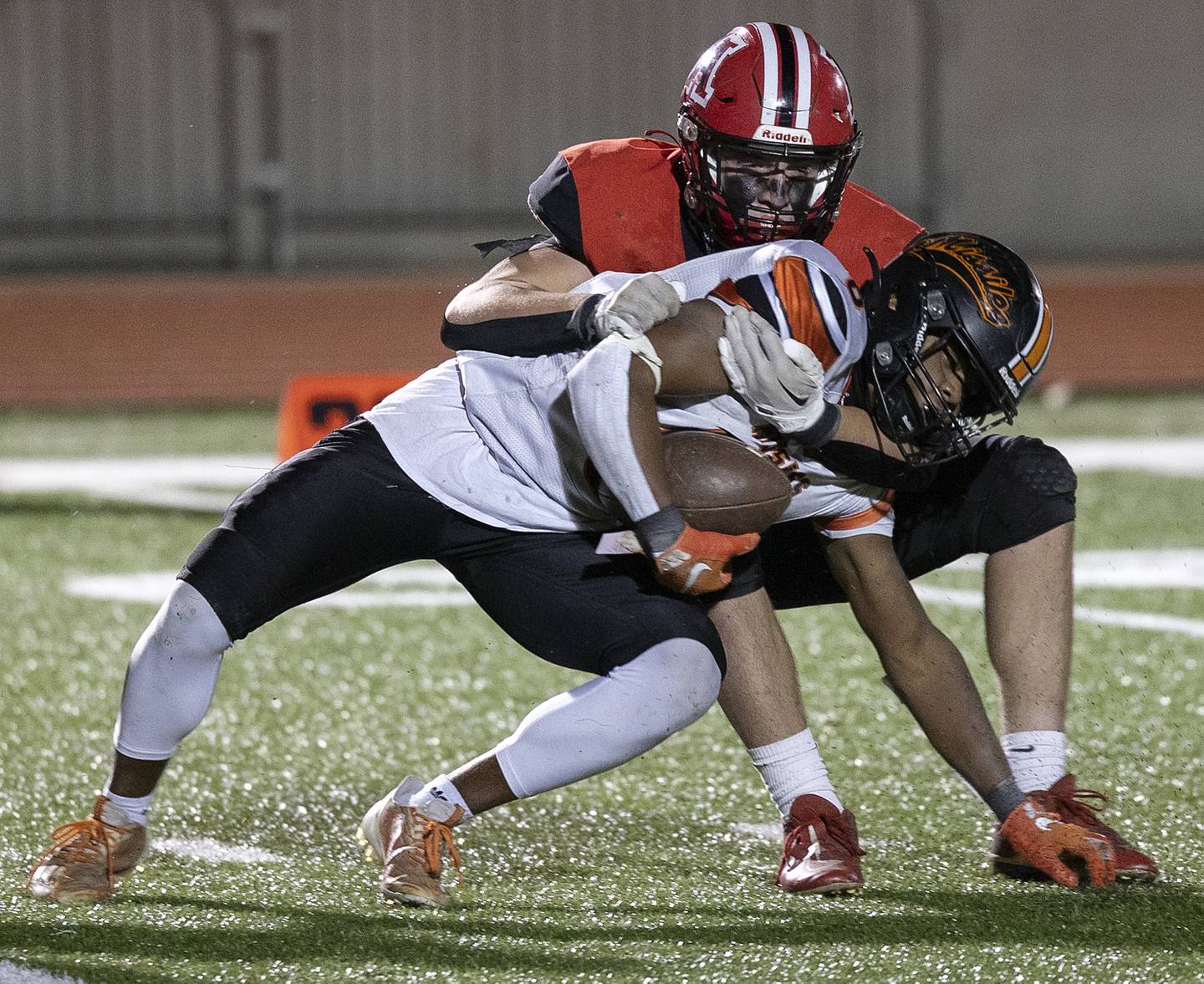 Milledgeville’s Micah Toms-Smith is tackled in the backfield by Amboy’s Evan Flanagan Friday, Nov. 22, 2024, during the 8-man football championship in Monmouth.