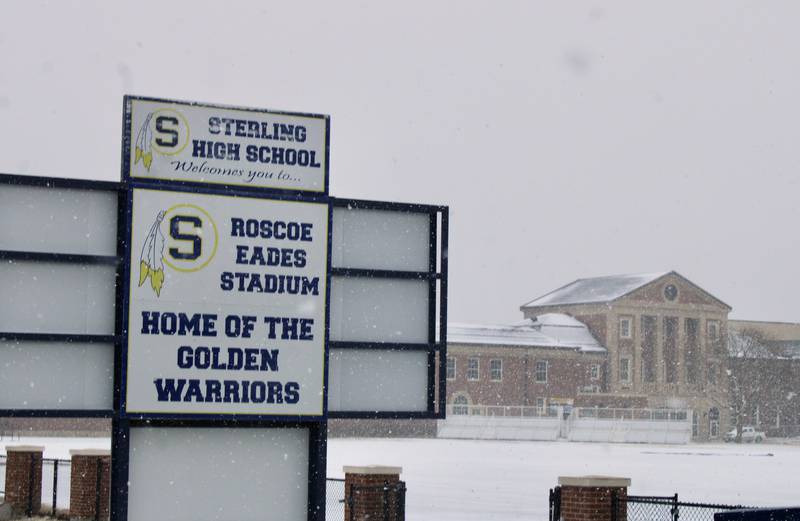 The snow falls heavily against the backdrop of Sterling High School as seen from across Roscoe Eades Stadium in Sterling on Thursday, Feb. 16, 2023.