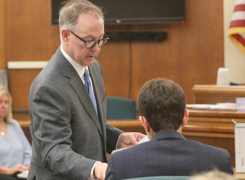 Chester Weger's defense attorney Andy Hale, presents exhibit to prosecutor Mark Shlifka during a mini trial evidentiary hearing regarding the Chester Weger case on Monday, May 12, 2025 at the La Salle County Government Complex in Ottawa.