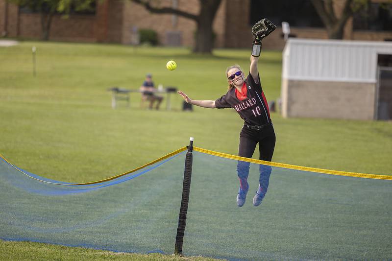 Henry’s center fielder Abbie Serpette leaps while trying to catch a home run against Morrison Wednesday, May 17, 2023.