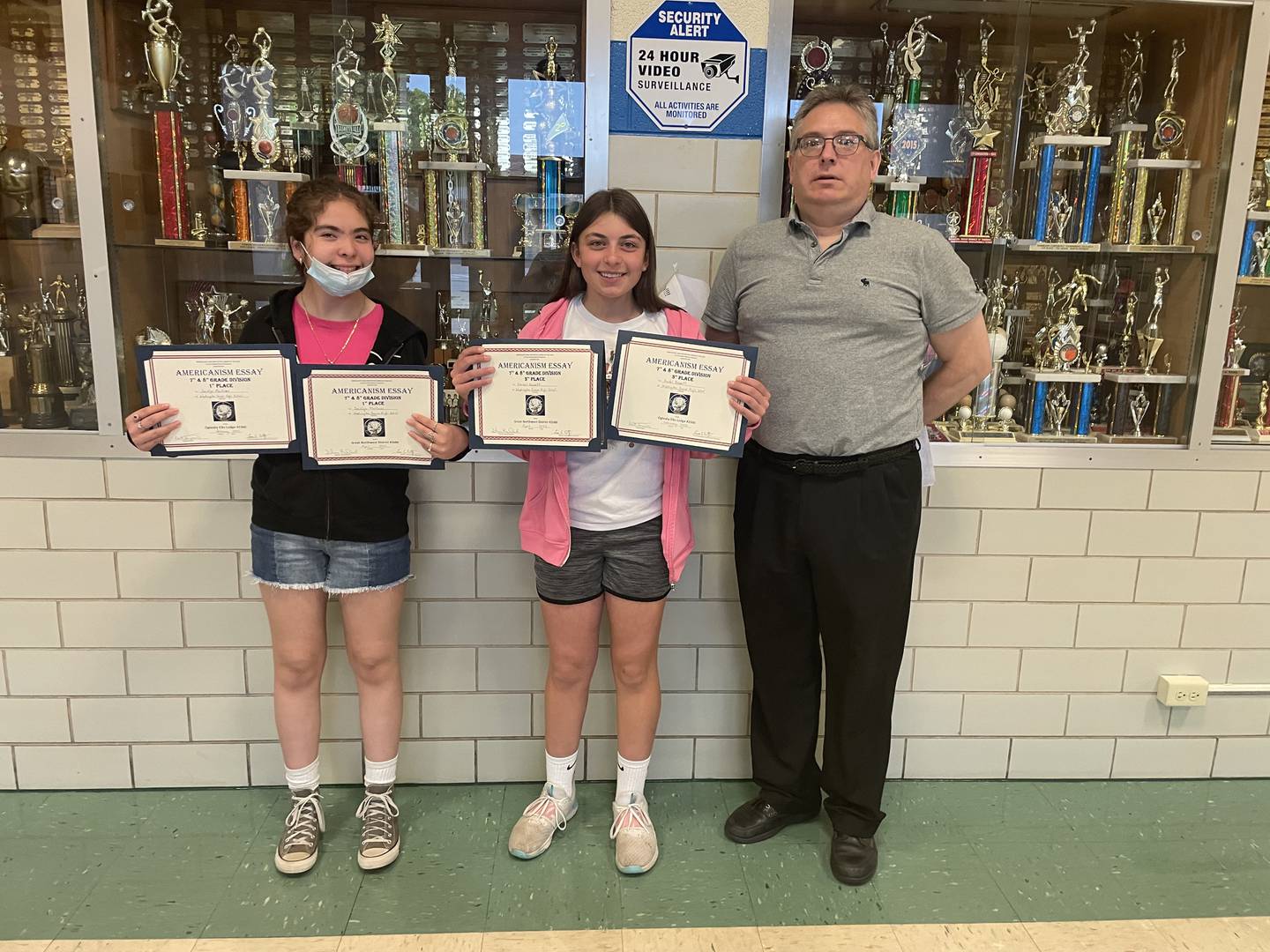 Pictured are (left to right) Jocelyn Martinez, seventh and eighth grade Oglesby Elks Lodge/district winner; Kendall Bassett, seventh and eighth grade Oglesby Elks Lodge/district third place winner; and Alan Zarbock, their English Language Arts teacher.