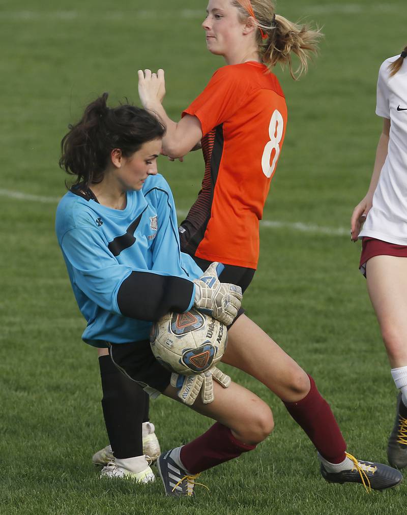 Prairie Ridge's Mia Pietramale grabs the ball as Crystal Lake Central's Carter Thompson tries to score a goal during a Fox Valley Conference soccer match Tuesday, May 10, 2022, between Crystal Lake Central and Prairie Ridge at Crystal Lake Central High School.
