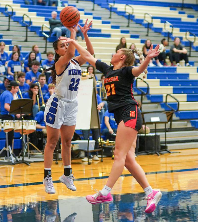 Geneva’s Leah Palmer (22) shoots a three pointer over Batavia’s Kylee Gehrt (21) during a basketball game at Geneva High School on Friday, Dec 15, 2023.