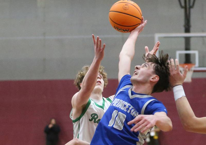 Princeton's Gavin Lanham reaches up to intercept a pass intended to Rock Falls's Kuitim Heald during the Class 2A Sectional final on Friday, March 7, 2025 at Marengo High School.