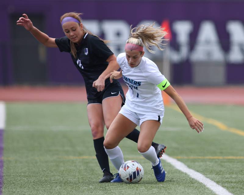 Downers Grove South's Grace Pappel (11) battles Downers Grove North's Caroline Siebert (16) for possession during soccer match between Downers Grove North at Downers Grove South.  May 6, 2023.