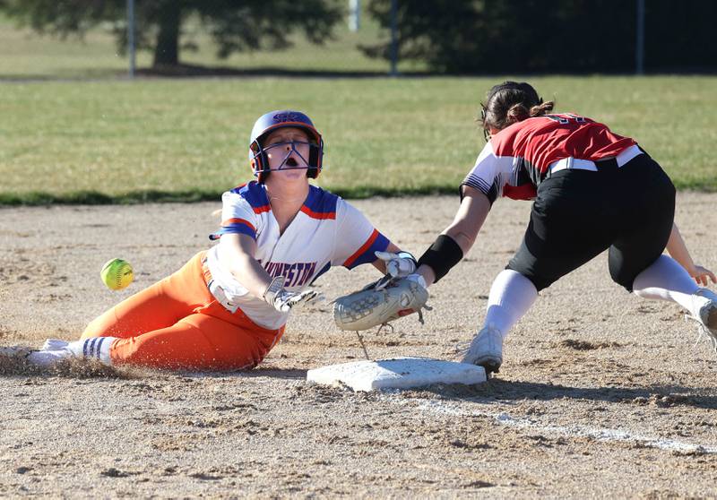 Genoa-Kingson's Emily Trzynka slides safely into third as Forreston’s Bailey Sterling tries to make the tag during their game Friday, March 15, 2024, at Genoa-Kingston High School.