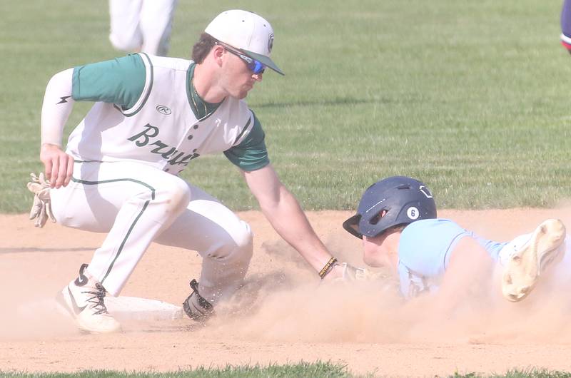 St. Bede's Gus Burr tags out Bureau Valley's Elijah Endress attempting to steal second base on Wednesday, May 14, 2025 at St. Bede Academy.