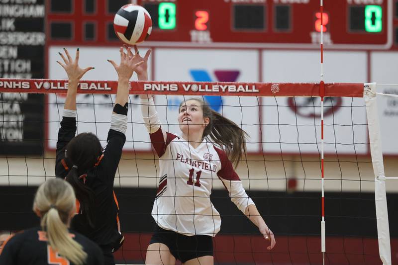 Plainfield North’s Lauren Jansen flips a shot against Plainfield East on Thursday night.
