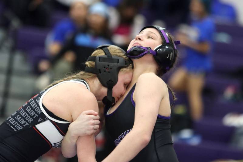 Hampshire’s Annabelle Mueller, right, battles St. Viator’s Charlotte Nold at 105 pounds in varsity girls IHSA Regional Championship wrestling action on Saturday, February 7, 2026, at Hampshire High School in Hampshire.