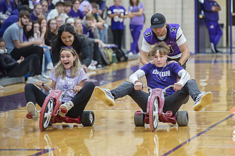 Competitors in the freshman and senior classes go head to head in the big wheel race Friday, Sept. 30, 2022 at Dixon high's homecoming pep rally.