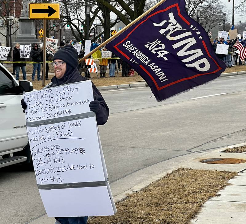 Clinton Kilepstein shows his support for President Donald Trump at a Sterling protest on Friday, March 7, 2025.