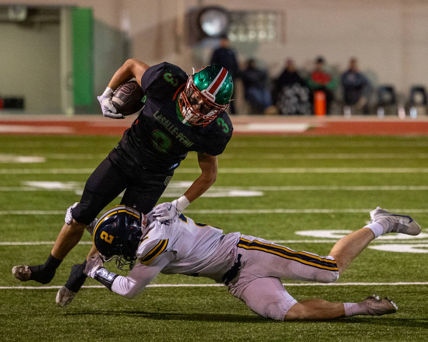 Rylynd Rynkewicz (3) of L-P runs ball as Samuel McCollum (2) of O' Fallon attempts to bring him down on Friday, October 24, 2025 at Howard Fellows Stadium in LaSalle.