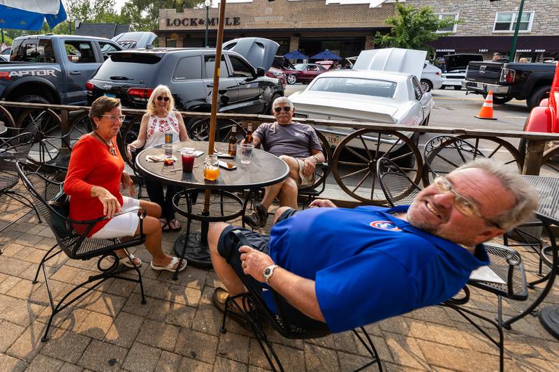 Lockport residents Dianna and Larry Cardani (front) and Cheri and Ron Hancock of Homer Glen enjoy drinks at Stagecoach as they take in the sights during Cruisin' Into Lockport on June 2, 2025.