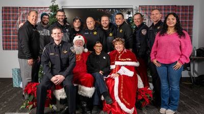 Kids open presents with Santa during the Yorkville Police Department’s annual ‘Shop with a Cop’