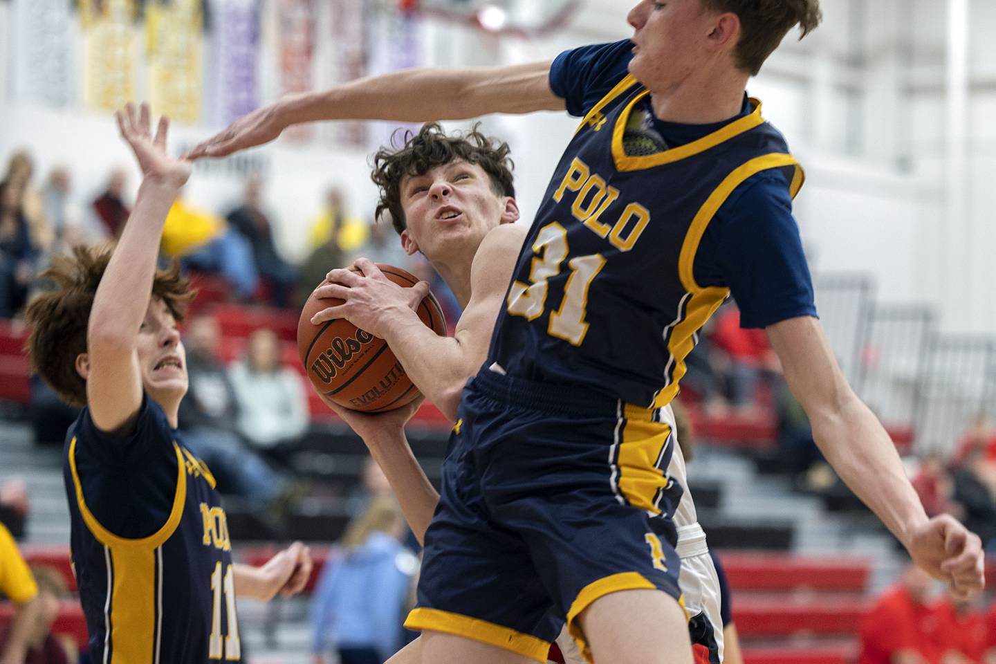 Amboy’s Eddie Jones works below the basket against Polo’s Ryelan Lindaas Wednesday, Jan. 25, 2023.