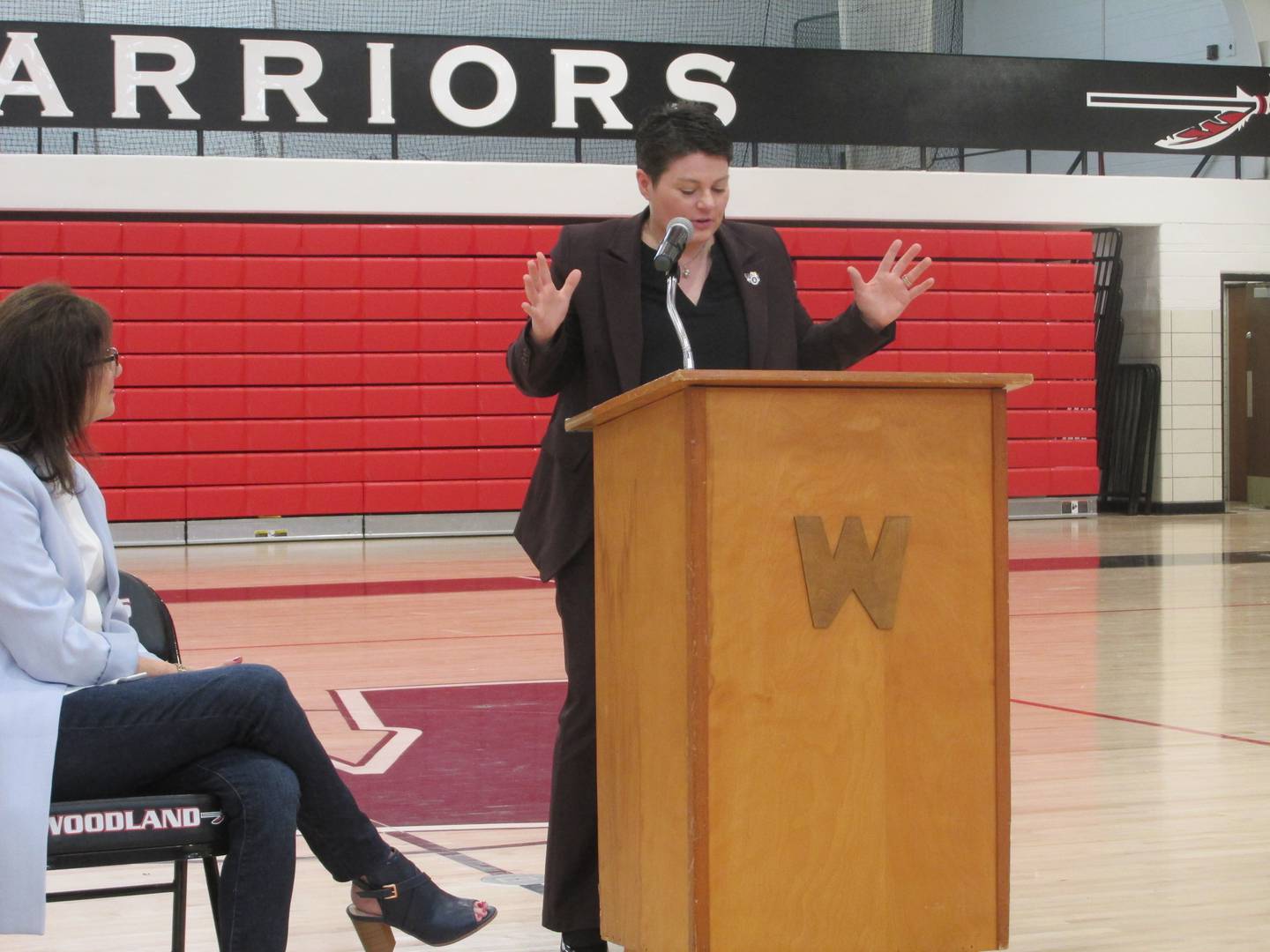 Woodland hall of fame inductee Jessica Wicks talks to students Friday, April 14, 2023, at the school's gymnasium, giving them four life tips.