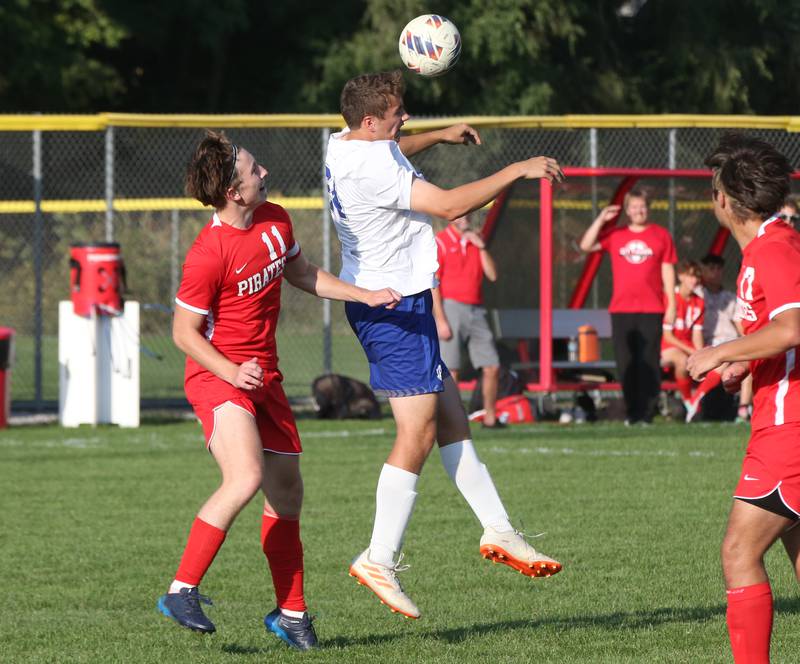 Princeton's Ben Anderson puts a header on the ball over Ottawa's Alexzander Houk on Tuesday, Oct. 3, 2023 at Ottawa High School.