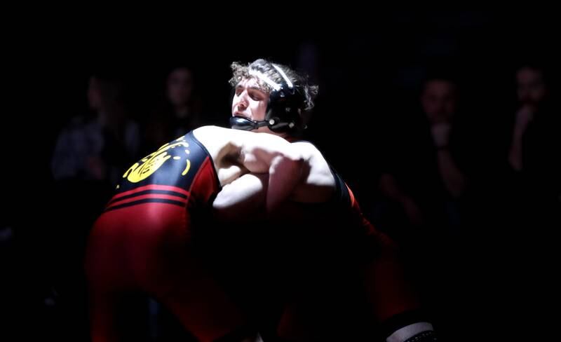St. Charles East’s Jayden Colon wrestles Batavia’s Aiden Huck in the 144-pound weight class during a dual meet in St. Charles on Thursday, Jan. 4, 2024.