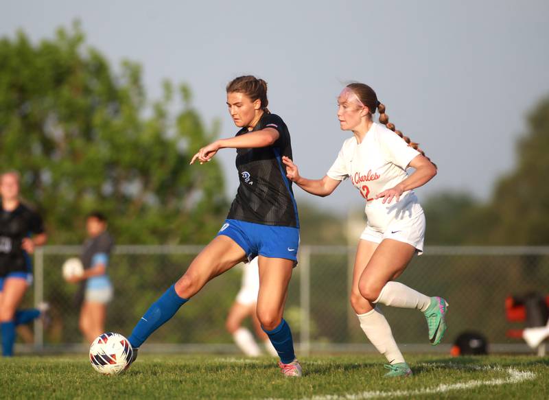 St. Charles North’s Kayla Floyd goes after the ball followed by St. Charles East’s Sophia Wollenberg during a Class 3A South Elgin Sectional semifinal game on Tuesday, May 21, 2024.