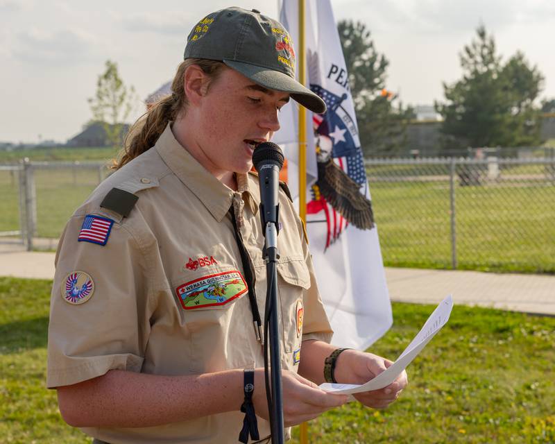 Zaden O'Dell gives a speech to the other members of Troop 123 on the importance and procedure of how burning weathered flags is the respectful way to retire them during the annual flag retirement ceremony at Veteran's Memorial Park on June 14, 2025 in Peru.