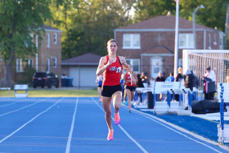 Lincoln-Way Central's Mia Forystek nears the finish line in first place in the 800-meter race during the IHSA Class 3A Chicago Heights Girls Track and Field Sectional at Bloom High School on Wednesday, May 13, 2026.