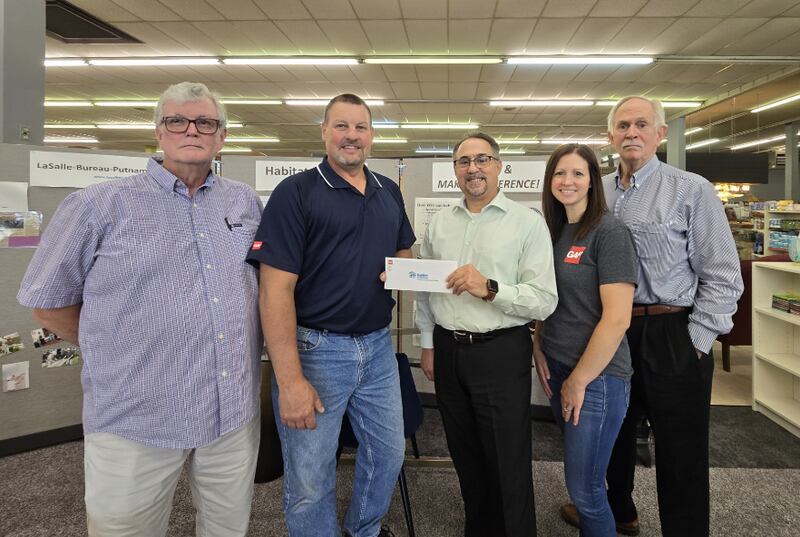GAF in Peru has made significant a donation to Habitat for Humanity La Salle-Bureau-Putnam Counties, Inc. from its Community Matters Program. At the check presentation are Dan Fitzgerald, Habitat LBPC executive director; Gary Ashley; Jim Lobraco, Habitat treasurer; Erin Moutray, GAF administrative assistant; and Lee McCullough, Habitat board secretary.