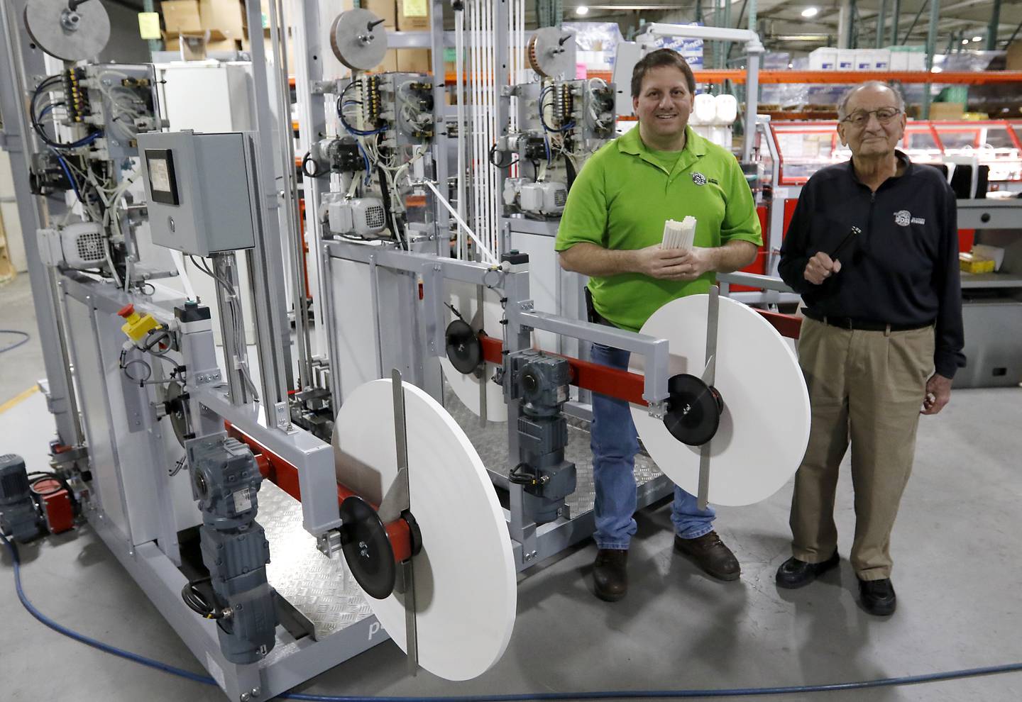 Guy Spinelli (right) and his son, Andy, of Boss Straw, on Wednesday, March 12, 2025, in Woodstock The company manufactures paper straws and has been hit hard by the federal government switching back to plastic straws.
