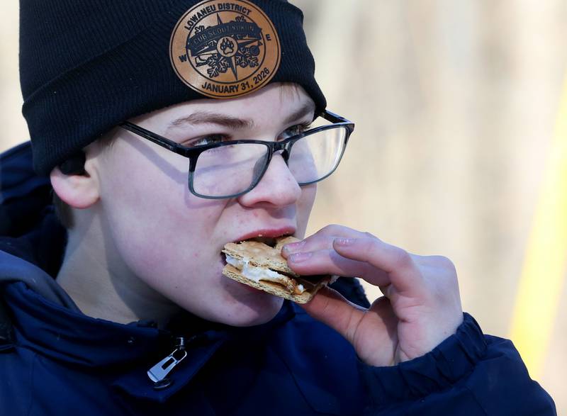 Trenton Cantrell of Mendota, eats a smore during the Lowaneu Cub Scout Yukon on Saturday, Jan. 31, 2026 at Hall Township Echo Bluff Park in Spring Valley.