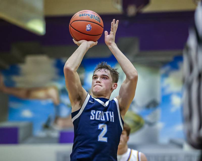 Downers Grove South's Will Potter (2) shoots a free throw during basketball game between Downers Grove South at Downers Grove North. Dec 16, 2023.