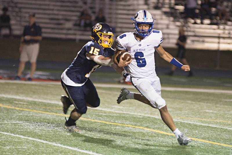 Sterling's Carter Ryan hauls down Quincy QB Adon Byquist for a big loss Friday, Oct. 01, 2021.