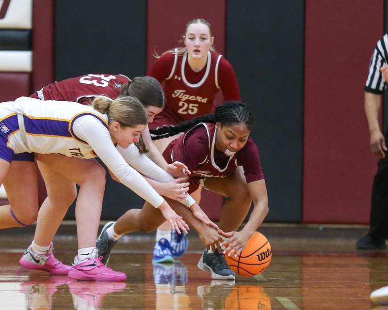 Both teams fight for possession during their Regional Final basketball game between Downers Grove North at Plainfield North. Feb 20, 2025 in Plainfield.
