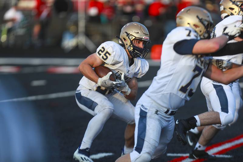 Lemont running back Sam Andreotti looks for a gap on Friday, April 16, 2021, at Bolingbrook High School in Bolingbrook, Ill.