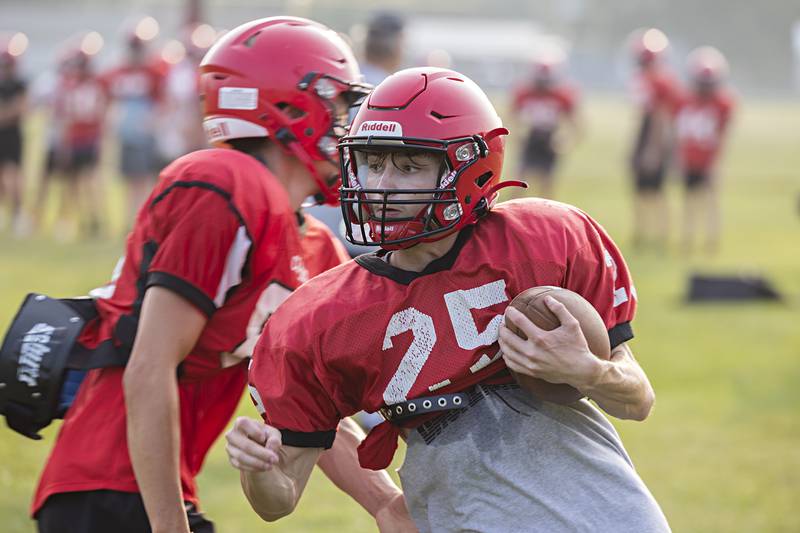 Amboy football players run through drills Monday, July 24, 2023 during a camp at the high school.