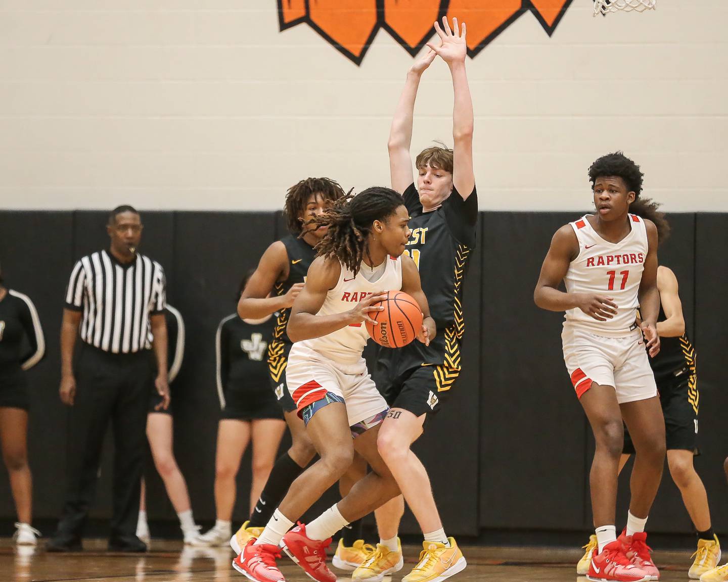 Joliet West's Drew King (21) defends the basket during Class 4A boys regional basketball game between Rich Township at Joliet West. Feb 23, 2024.