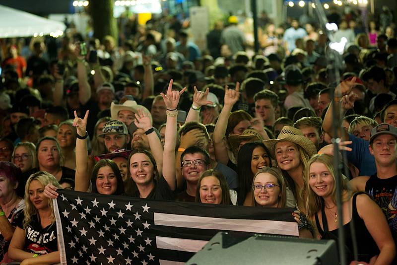 Music fans celebrate Friday night headliner Travis Denning July 1, 2022 at Dixon’s Petunia Fest. Lots more music to be heard on Saturday and Sunday at the festival.