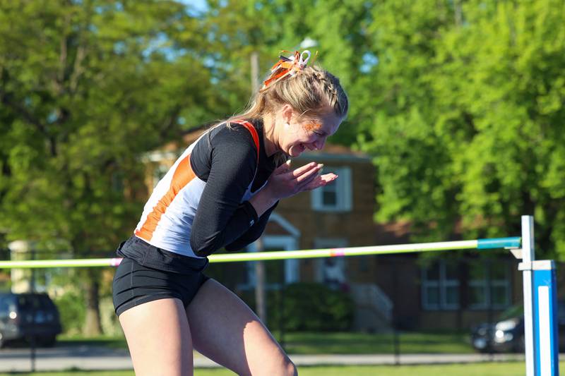 Lincoln-Way West's Mia DiBenedetto reacts to clearing the state-qualifying height of 1.57 meters in the high jump during the IHSA Class 3A Chicago Heights Girls Track and Field Sectional at Bloom High School on Wednesday, May 13, 2026.