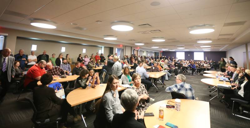 A large crowd attends the Illinois Valley Community College Board of Trustees Candidate Crystal Loughran, speaks during a candidate forum on Wednesday, March 22, 2023 at IVCC.