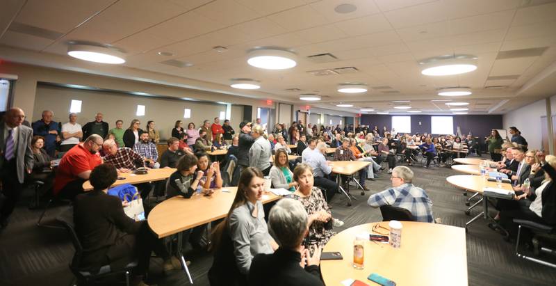 A large crowd attends the Illinois Valley Community College Board of Trustees Candidate Crystal Loughran, speaks during a candidate forum on Wednesday, March 22, 2023 at IVCC.