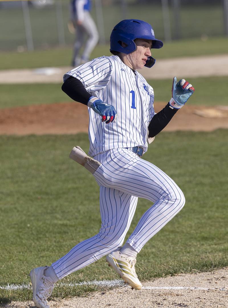 Newman’s Garret Matznick rounds first for a double against Princeton Monday, April 6, 2026.