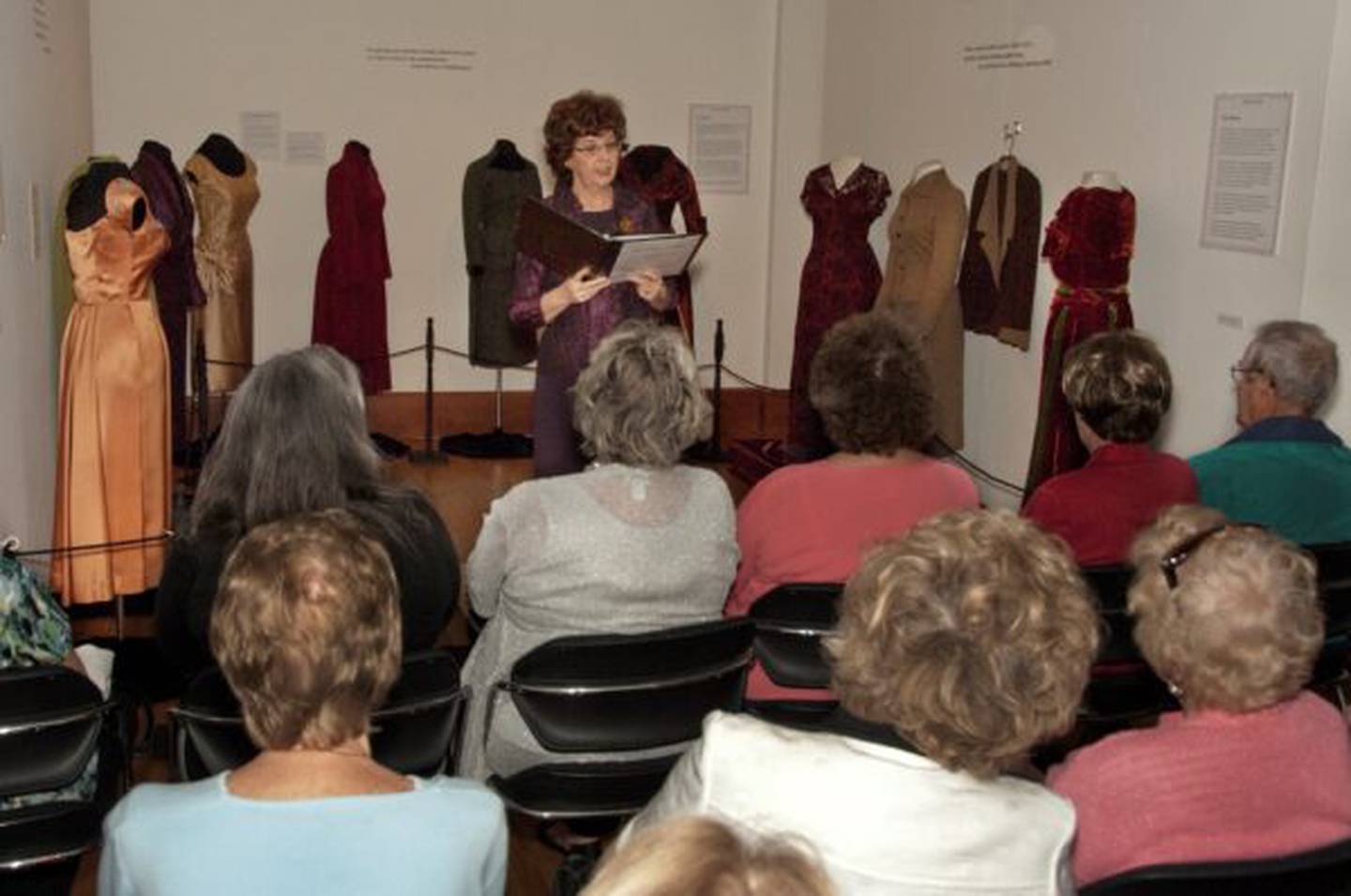 The late Barbara Cole Peters, shown in this 2010 file photo, gives a presentation for her art exhibit "The Autumn Leaves" on Northern Illinois University campus in DeKalb. Peters, who died on Nov. 11, 2024, was remembered as NIU's First Lady when her husband, John Peters, was NIU president.