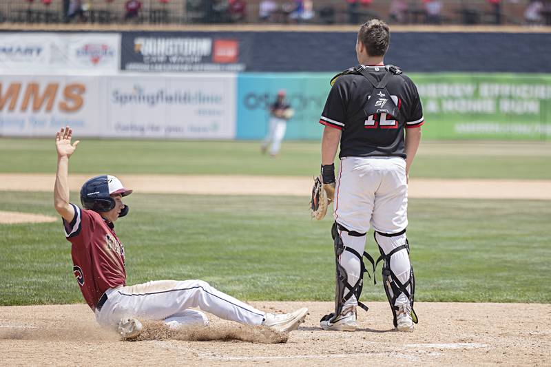 Gibrault’s Tyler Frierdich slides in to score against Henry-Senachwine Saturday, June 3, 2023 during the IHSA class 1A championship baseball game.